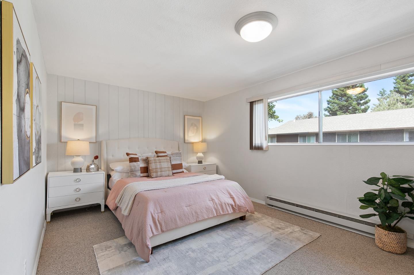 108 East Middlefield Road, Unit D Mountain View, CA 94043 - Photo 17 of 23 a bedroom with a bed and a potted plant