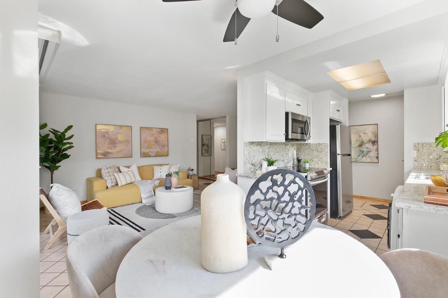 108 East Middlefield Road, Unit D Mountain View, CA 94043 - Photo 4 of 23 a bedroom with a large bed and a chandelier