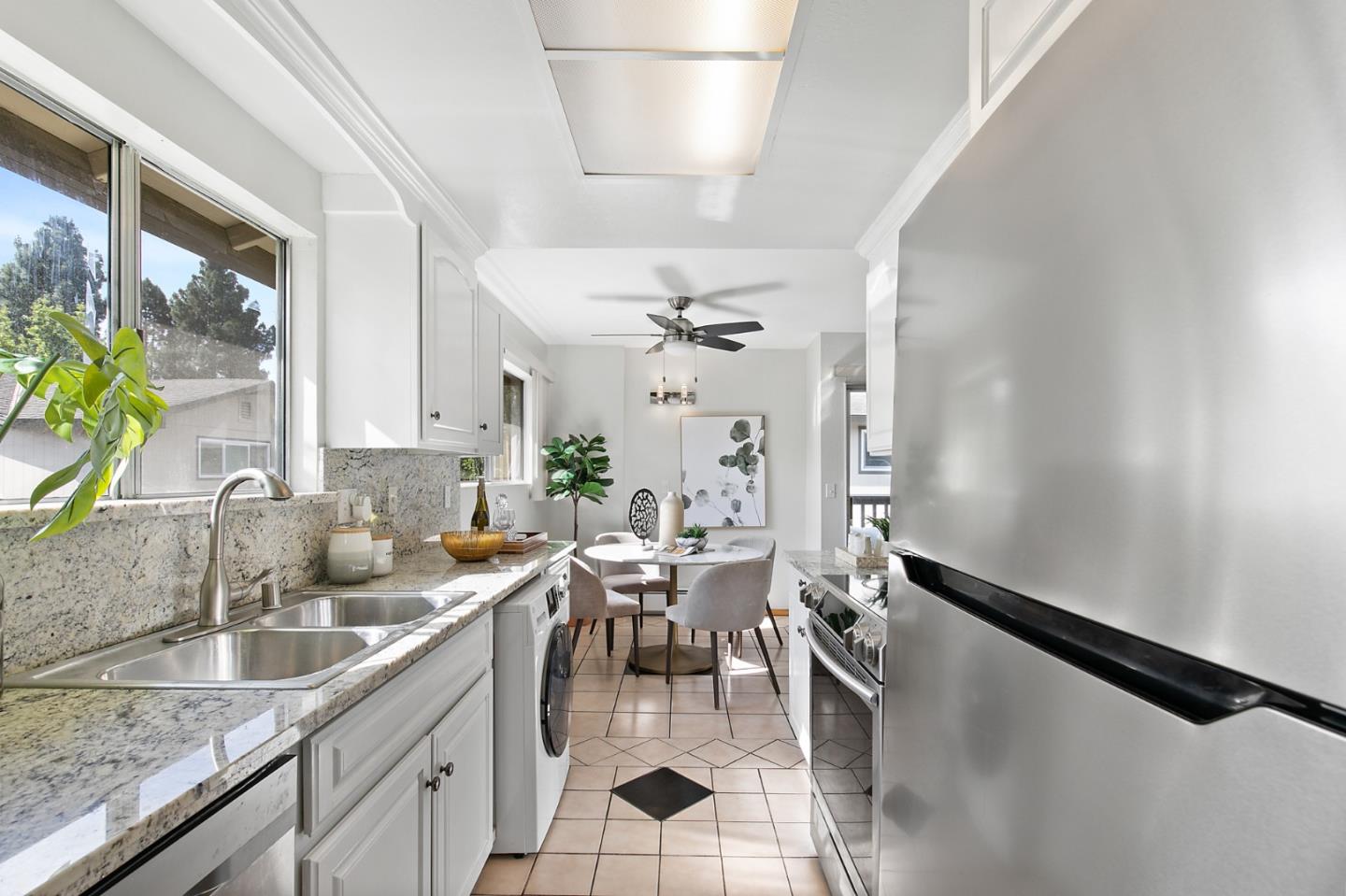 108 East Middlefield Road, Unit D Mountain View, CA 94043 - Photo 8 of 23 a very nice looking dining room with a large window and chandelier