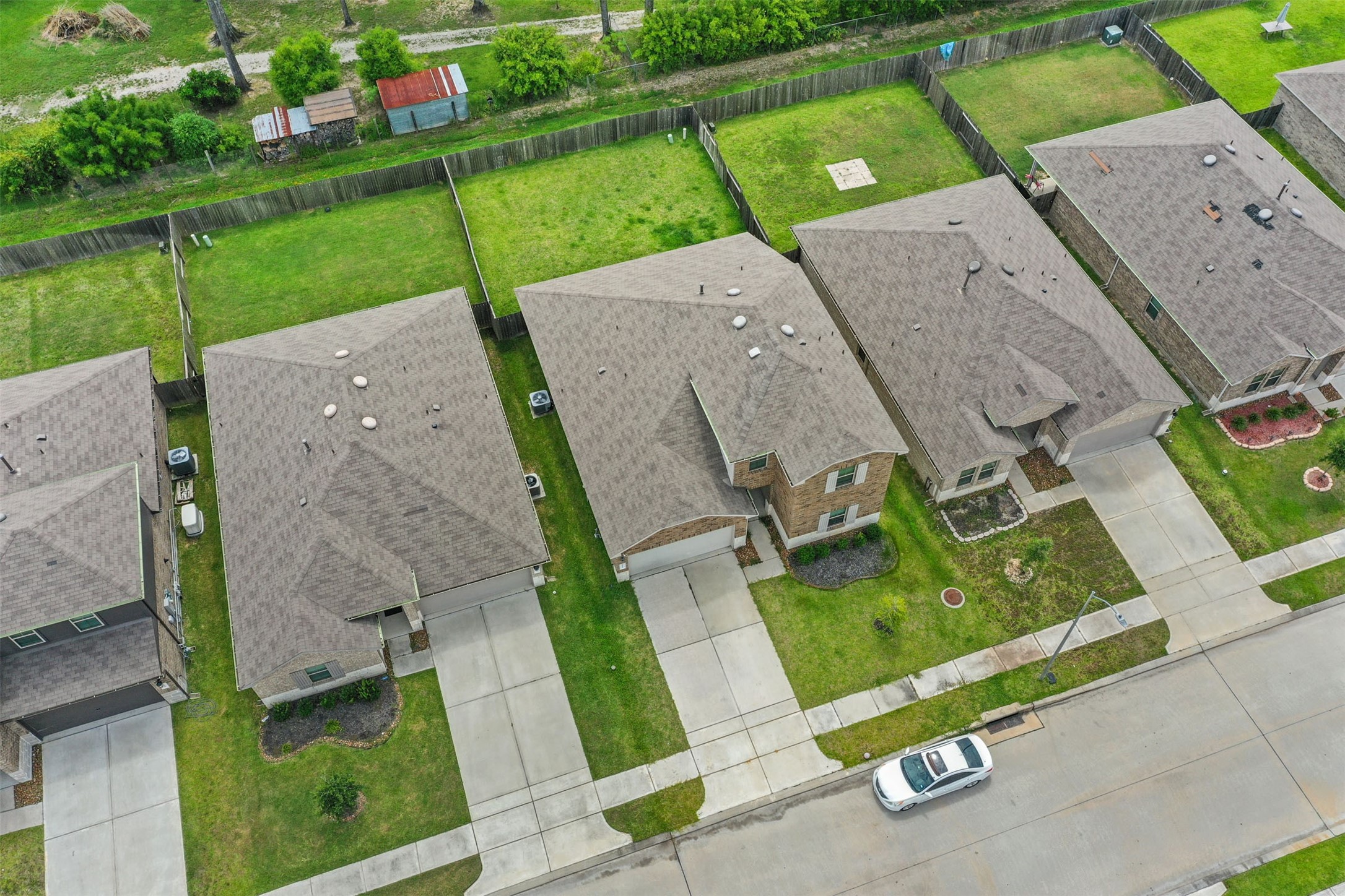 23711 Blodgett Peak Trail Spring, TX 77373 - Photo 22 of 32 an aerial view of a house with a yard and lake view