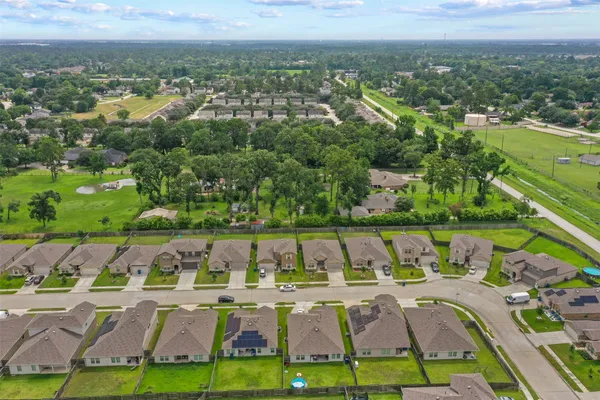 an aerial view of residential houses with outdoor space