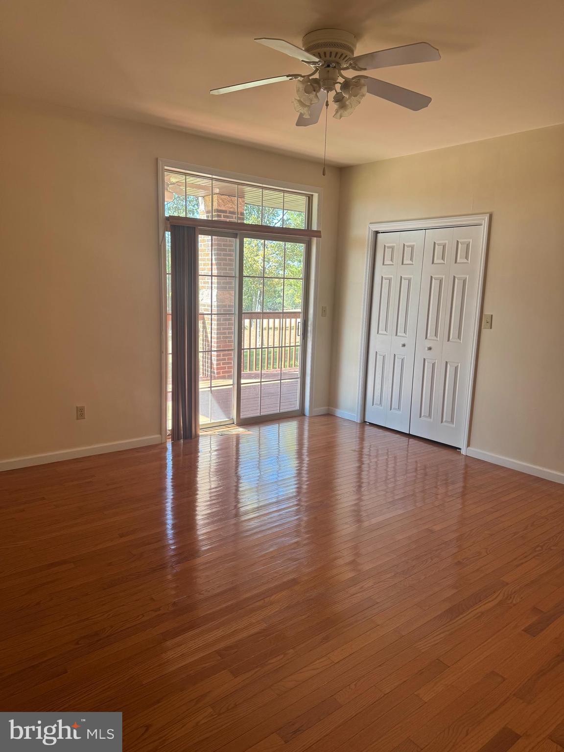 1303 Country Club Drive Hazleton, PA 18202 - Photo 12 of 13 a view of an empty room with wooden floor and a window