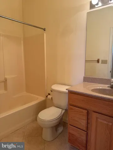 a bathroom with a toilet a sink and bathtub