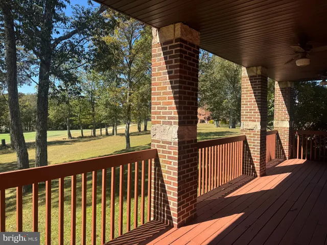 a view of a balcony with wooden floor