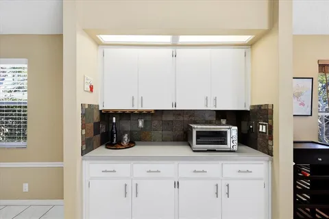 a kitchen with a stove and a microwave