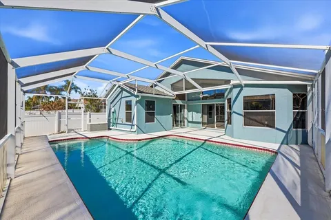 a view of a house with pool porch and wooden floor