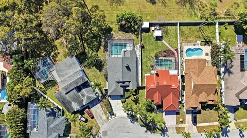 an aerial view of houses with outdoor space