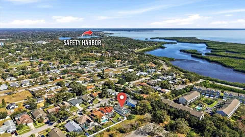 an aerial view of residential houses with city view