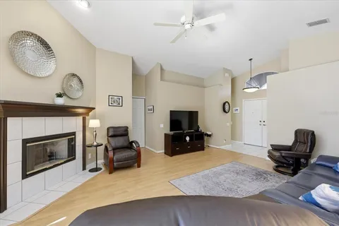 a living room with furniture and a fireplace