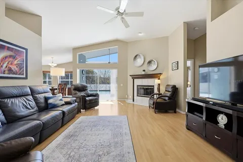 a living room with furniture fireplace and flat screen tv