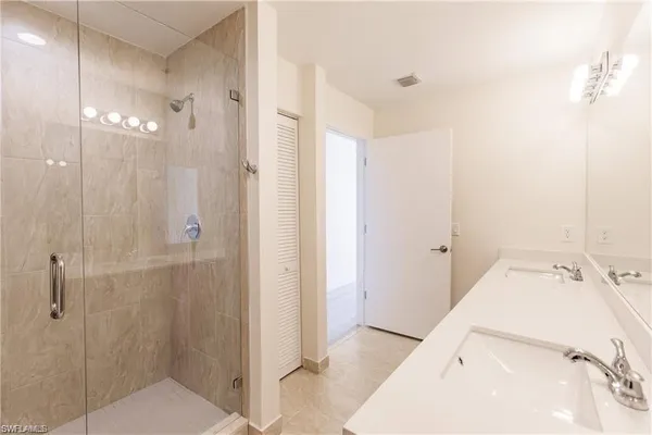 a view of a hallway with washer and dryer