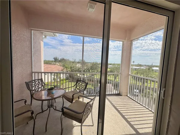 a bedroom with a bed and flat screen tv