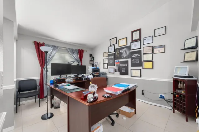 a room with furniture and musical instruments