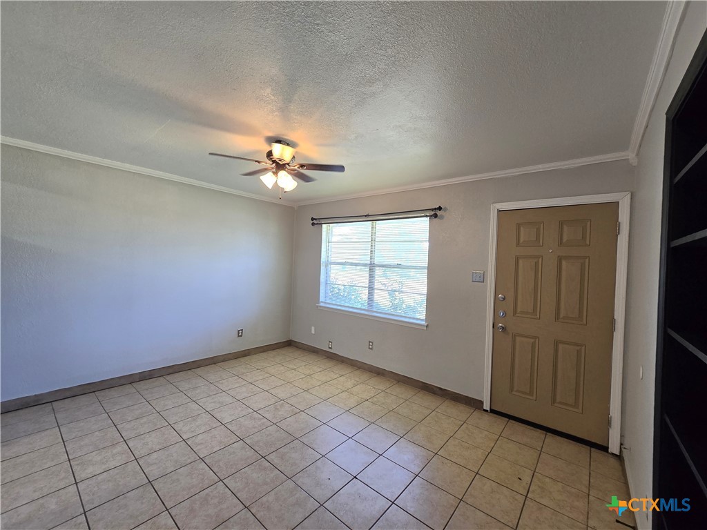 212 East Valley Road, Unit B Harker Heights, TX 76548 - Photo 11 of 16 an empty room with a ceiling fan and window