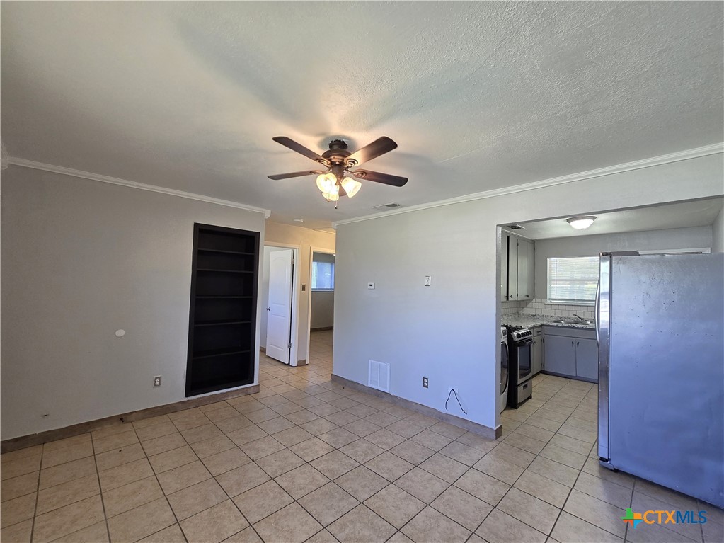 212 East Valley Road, Unit B Harker Heights, TX 76548 - Photo 13 of 16 a view of an empty room with window and cabinet