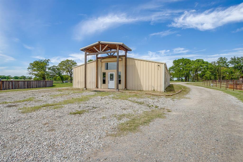 990 Doss Road Millsap, TX 76066 - Photo 25 of 39 a front view of a house with a yard