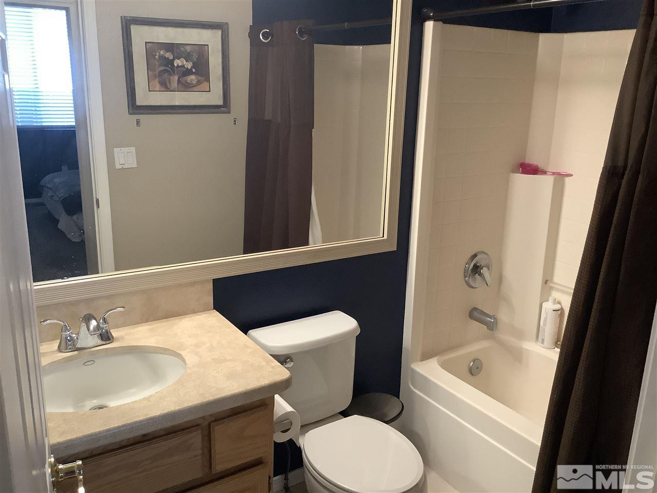 1605 Cattlemen Court Reno, NV 89521 - Photo 12 of 18 a bathroom with a sink toilet and shower