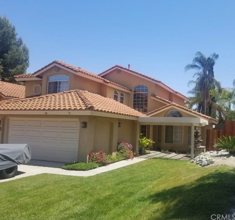 20475 Marcus Road Riverside, CA 92508 - Photo 1 of 1 a front view of a house with a yard and garage