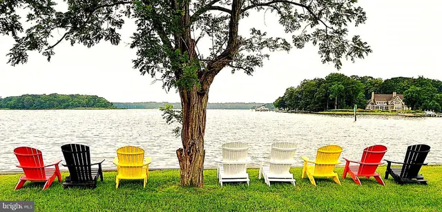 a view of swimming pool with a table and chairs