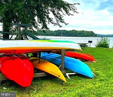 swimming pool with outdoor seating and yard