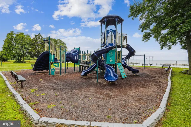 a view of a park with iron fence