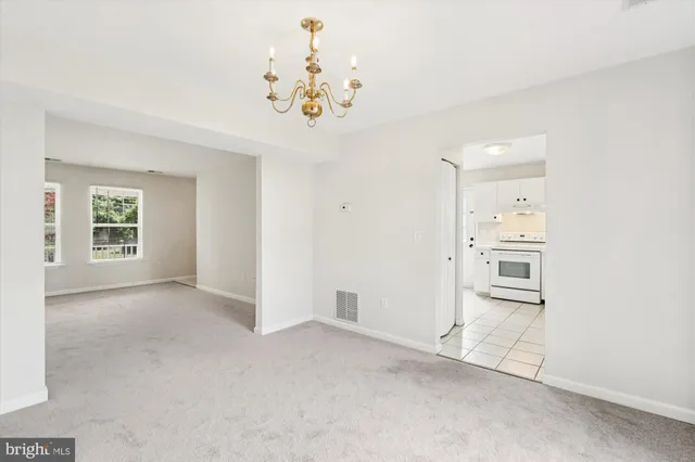 an empty room with windows and entrance