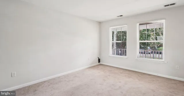 a kitchen with cabinets appliances and a sink