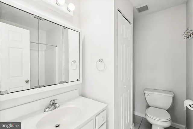 a balcony with wooden floor and fence