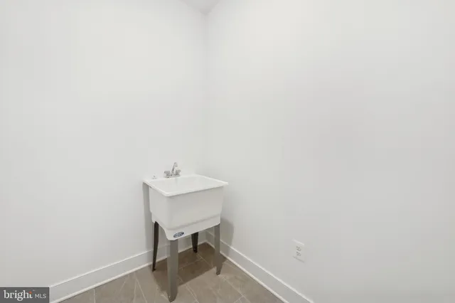 a bathroom with a sink a mirror and a toilet