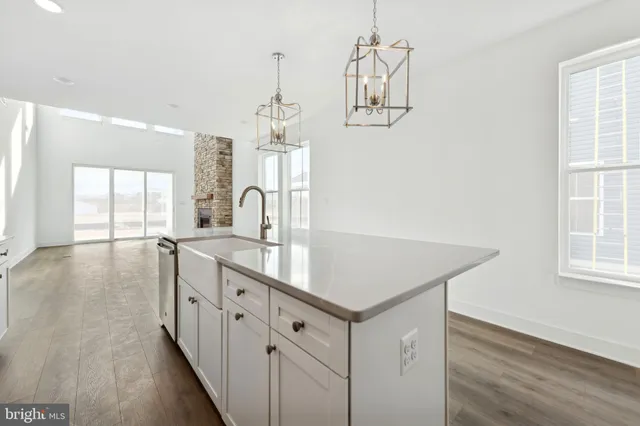 a kitchen with sink cabinets and window