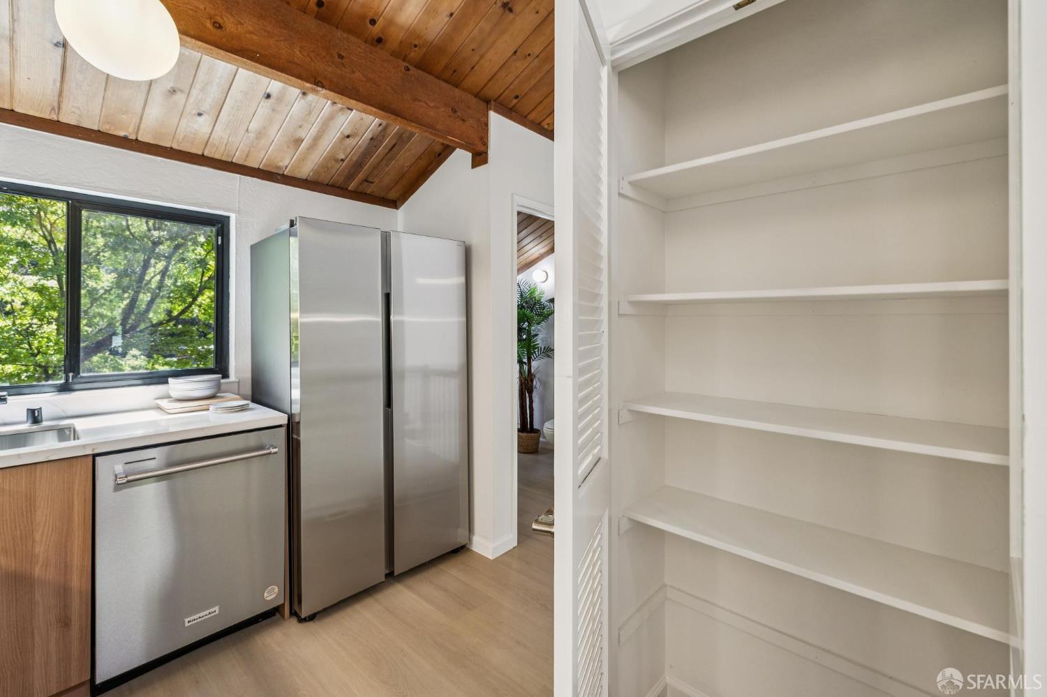 229 Cypress Point Drive Mountain View, CA 94043 - Photo 11 of 32 a kitchen with stainless steel appliances a refrigerator and a cabinets