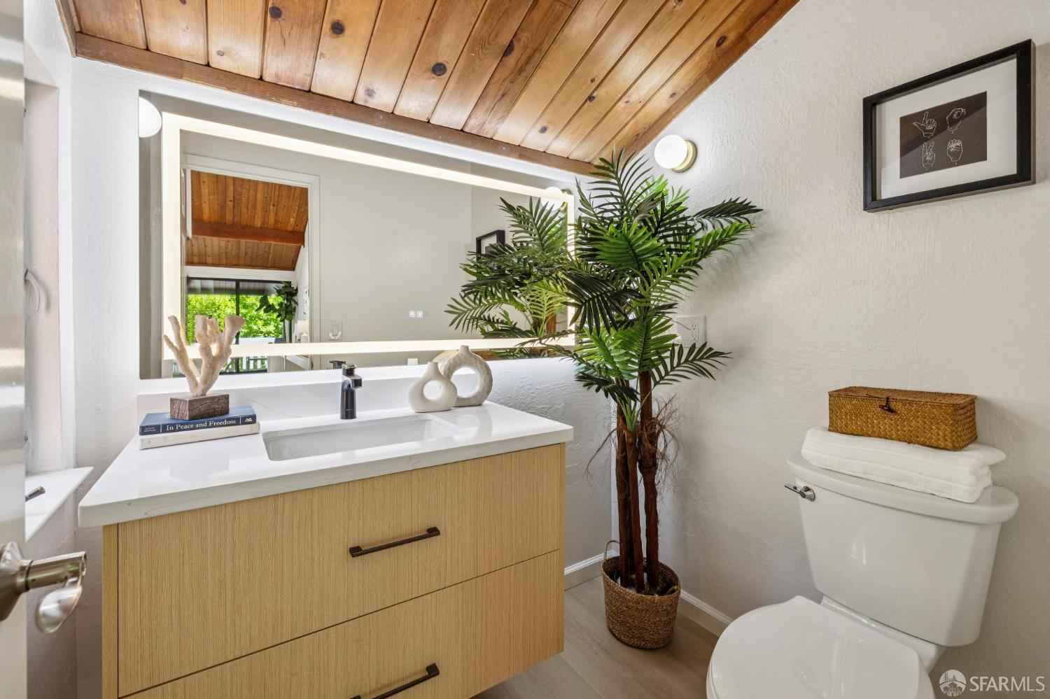 229 Cypress Point Drive Mountain View, CA 94043 - Photo 12 of 32 a bathroom with a toilet a sink and mirror