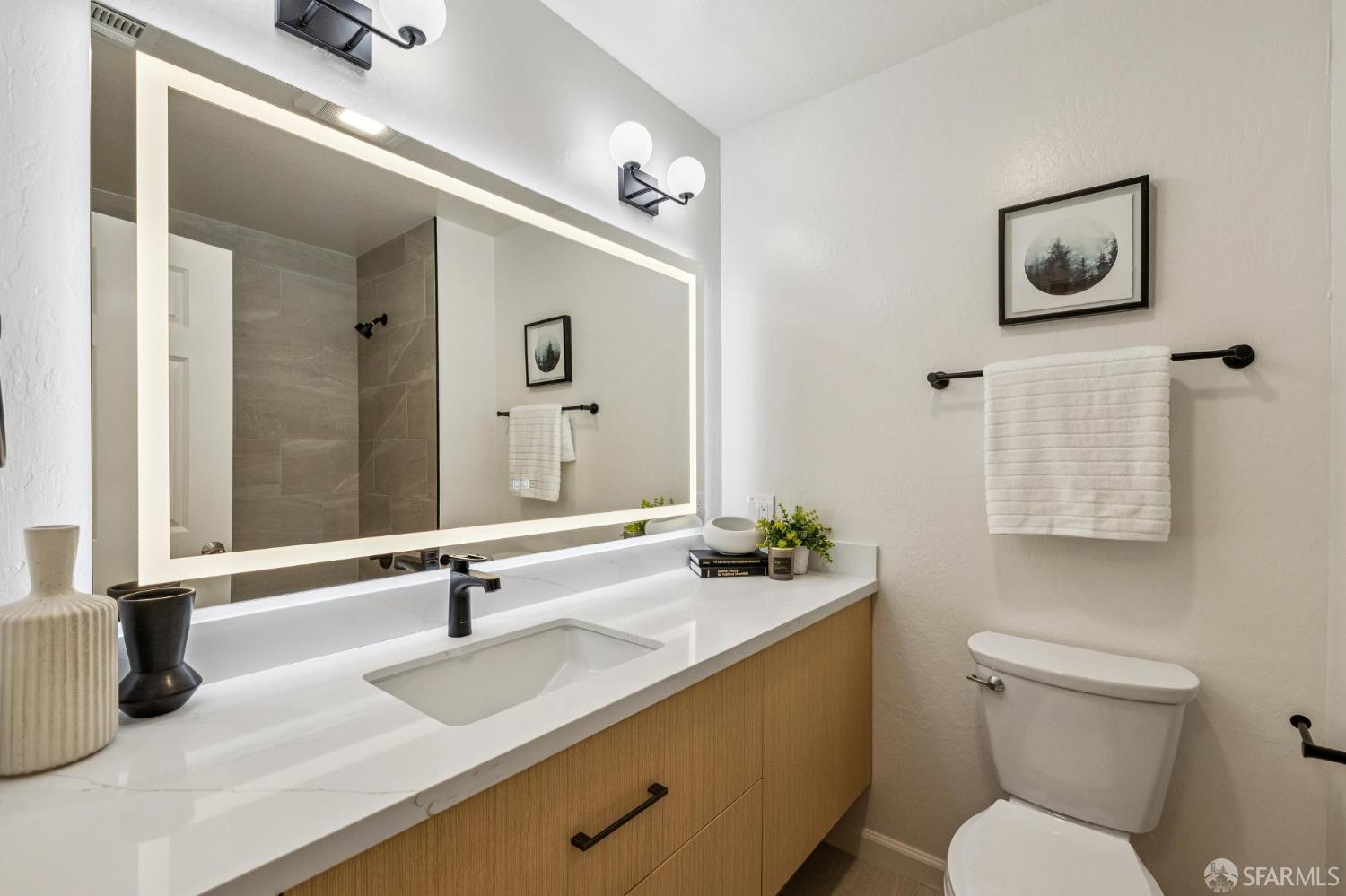 229 Cypress Point Drive Mountain View, CA 94043 - Photo 21 of 32 a bathroom with a toilet sink and mirror