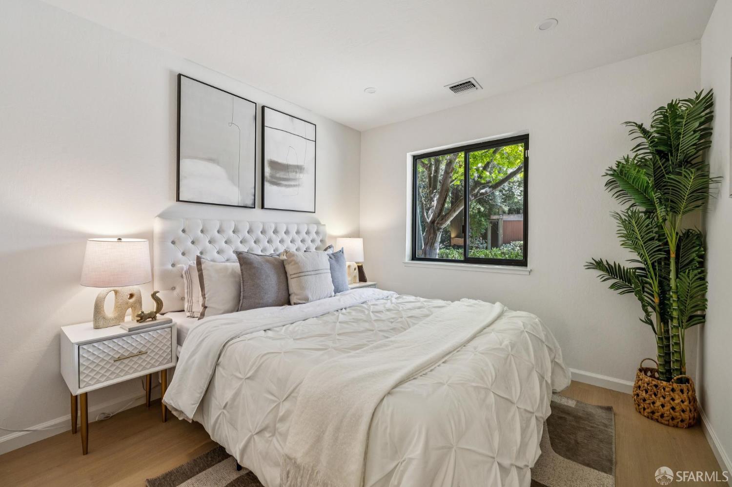 229 Cypress Point Drive Mountain View, CA 94043 - Photo 23 of 32 a bedroom with a bed and a potted plant