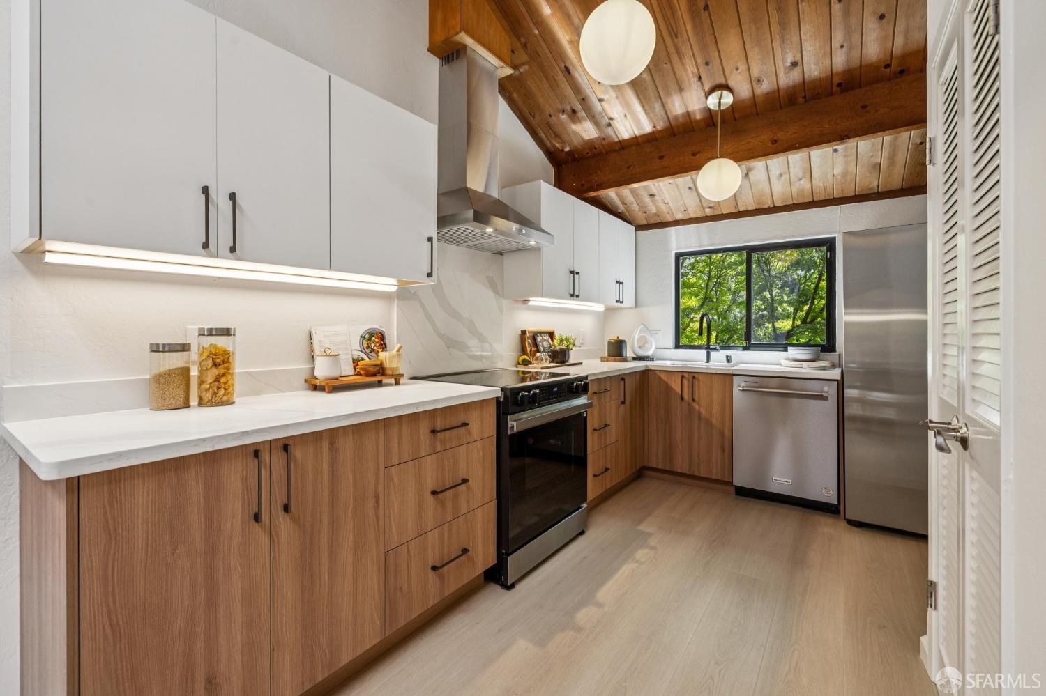 229 Cypress Point Drive Mountain View, CA 94043 - Photo 7 of 32 a kitchen with a sink cabinets stainless steel appliances and a window