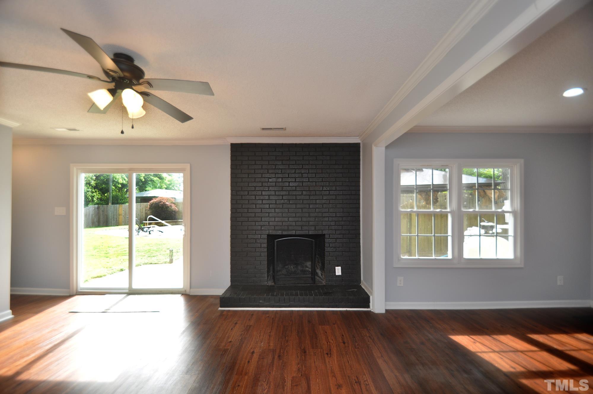 2401 Sanderford Road Raleigh, NC 27610 - Photo 12 of 31 a living room with furniture and a fireplace