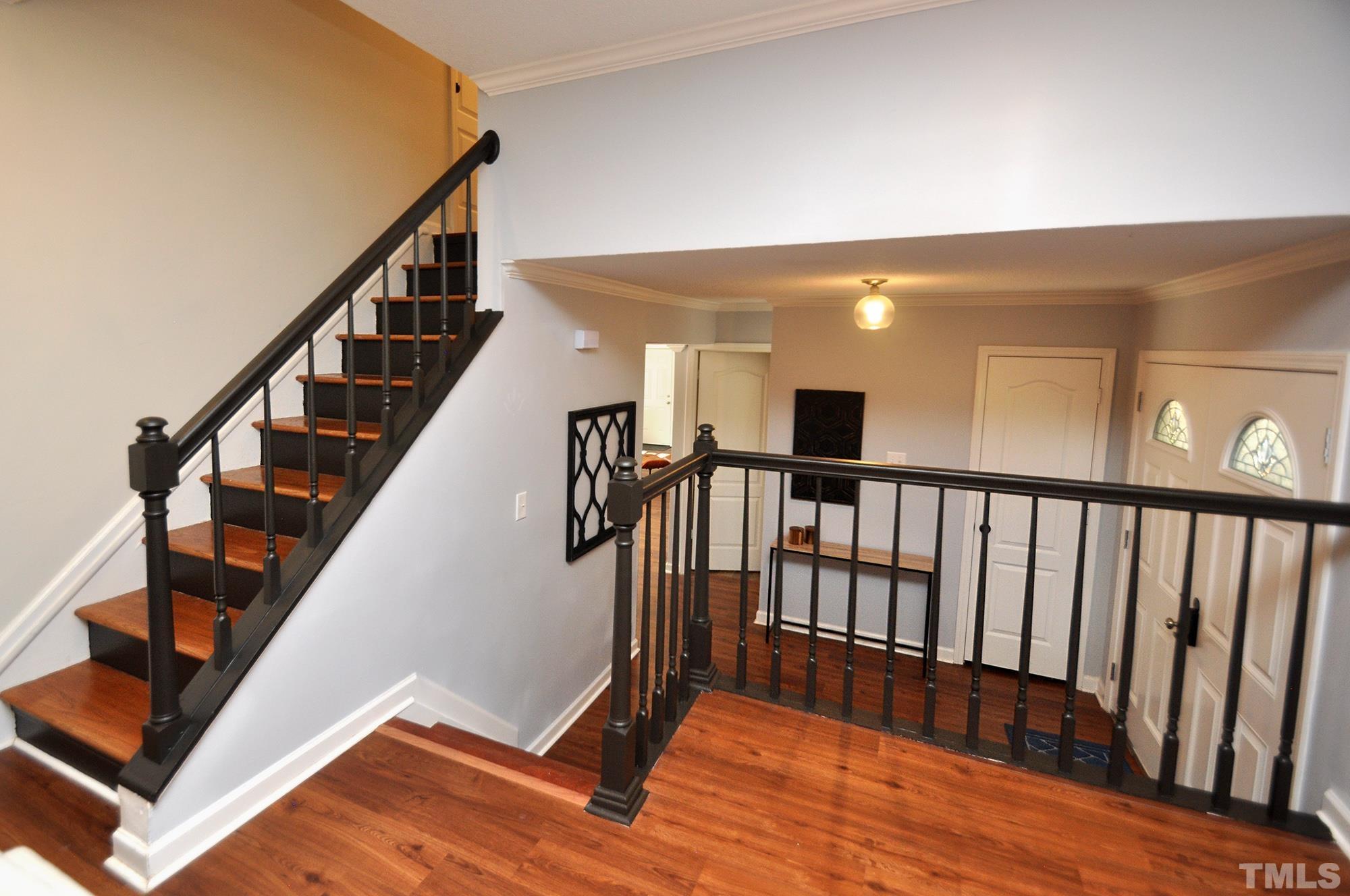 2401 Sanderford Road Raleigh, NC 27610 - Photo 16 of 31 a view of entryway with wooden floor