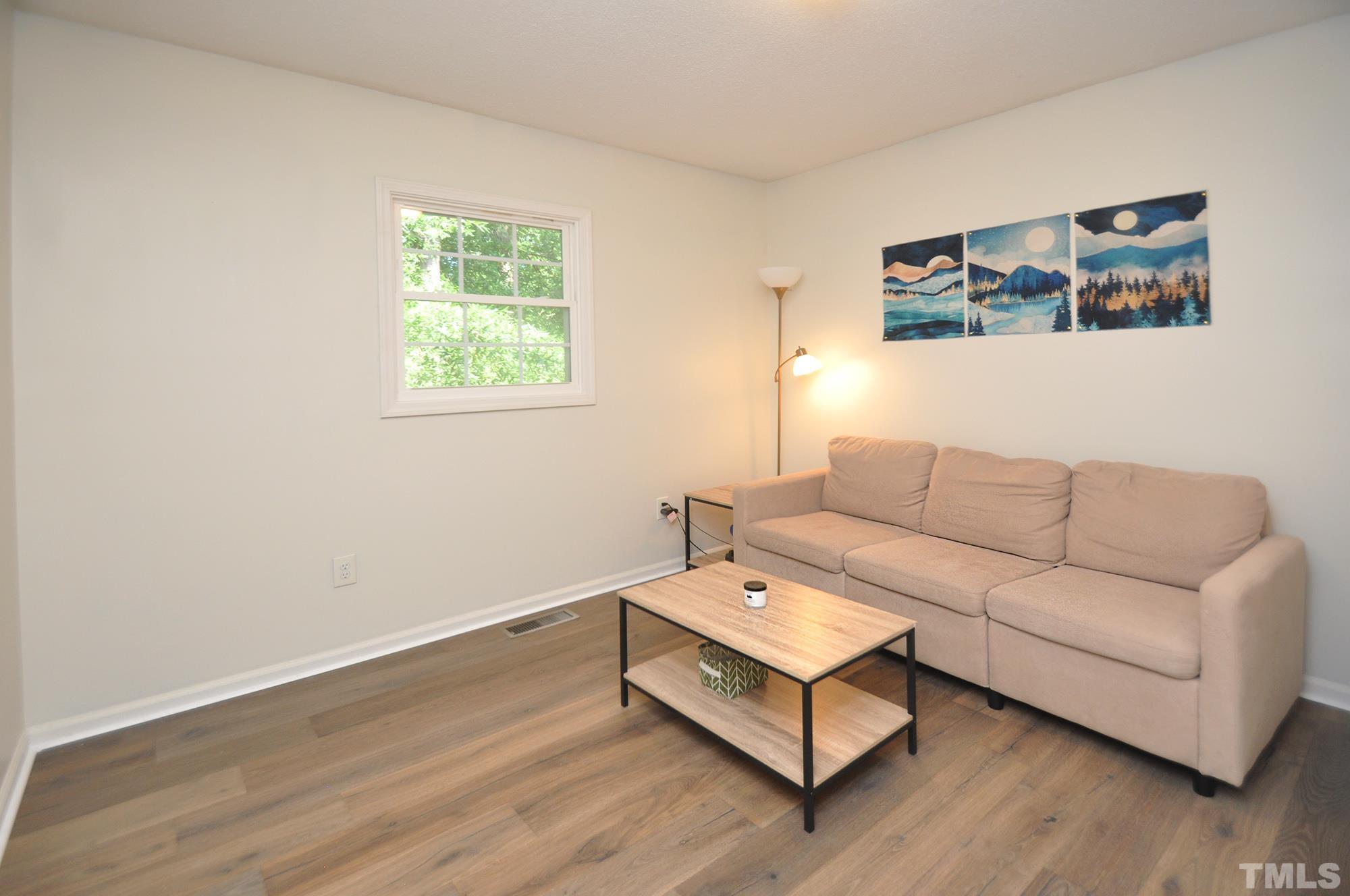 2401 Sanderford Road Raleigh, NC 27610 - Photo 24 of 31 a living room with furniture and a window