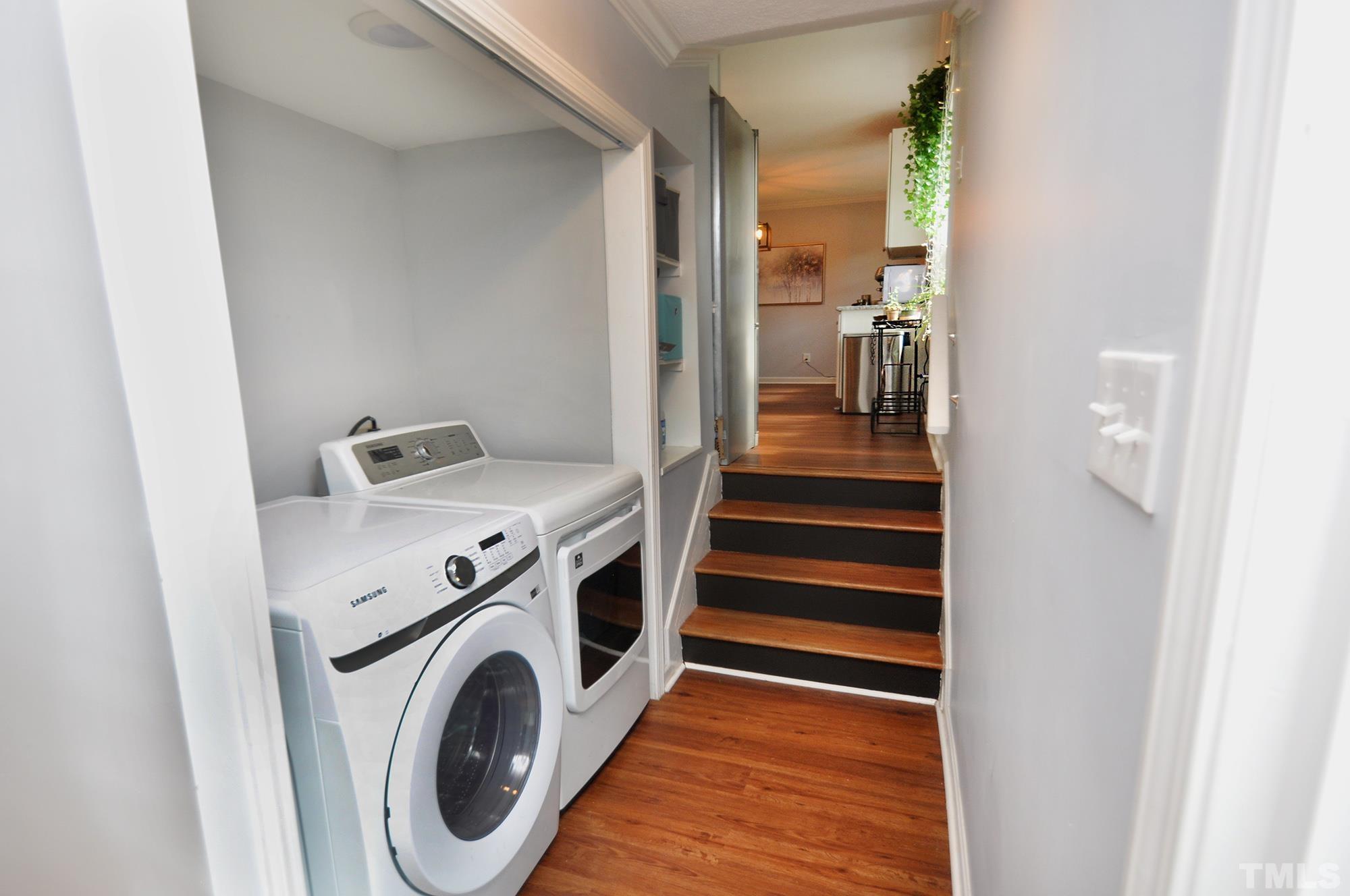 2401 Sanderford Road Raleigh, NC 27610 - Photo 26 of 31 a view of storage and utility room with washer and dryer