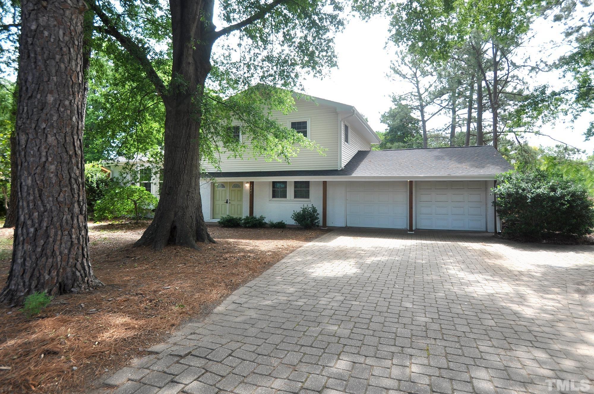 2401 Sanderford Road Raleigh, NC 27610 - Photo 31 of 31 a view of a house with a yard and large tree
