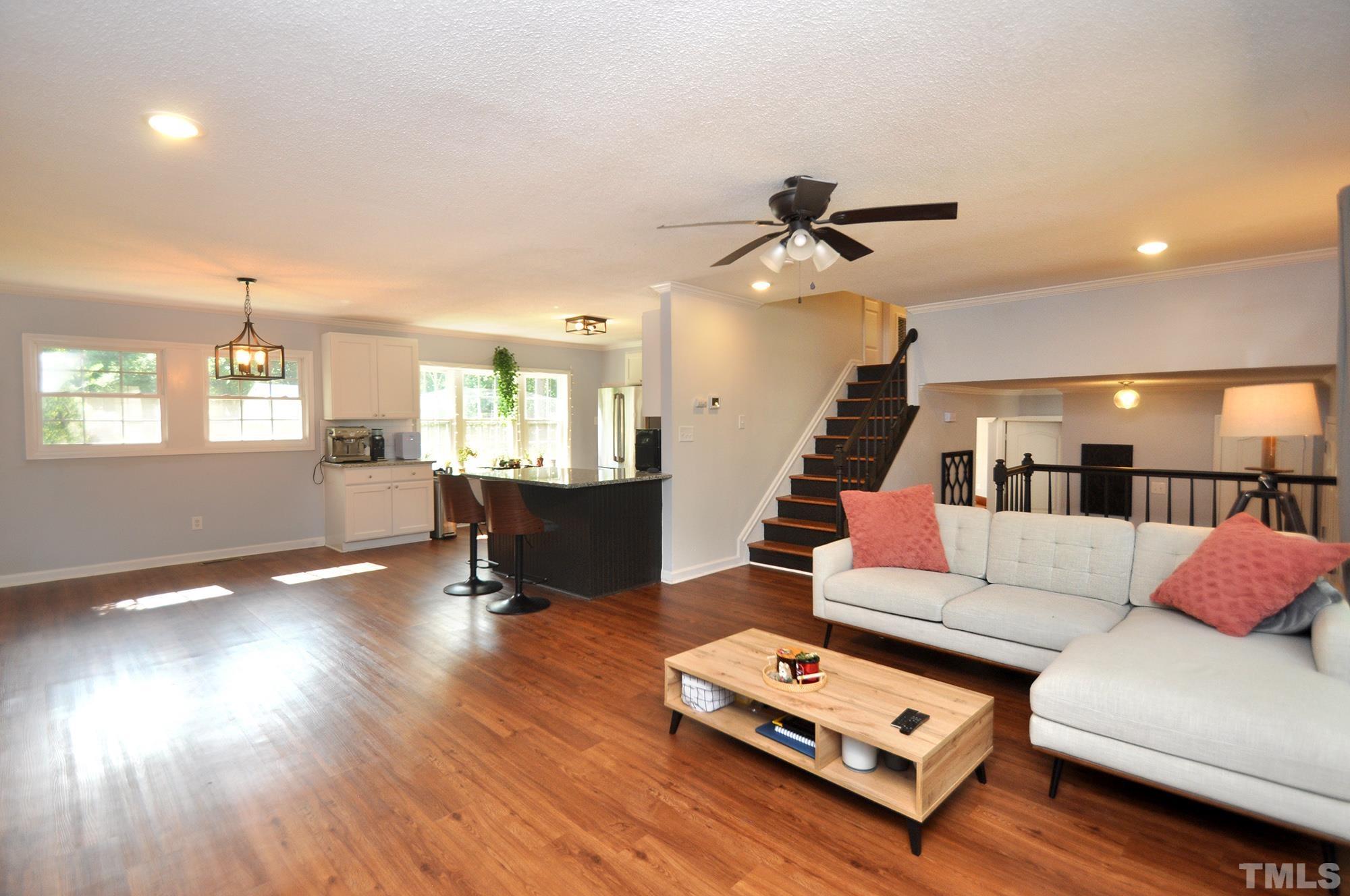 2401 Sanderford Road Raleigh, NC 27610 - Photo 5 of 31 a living room with furniture and wooden floor