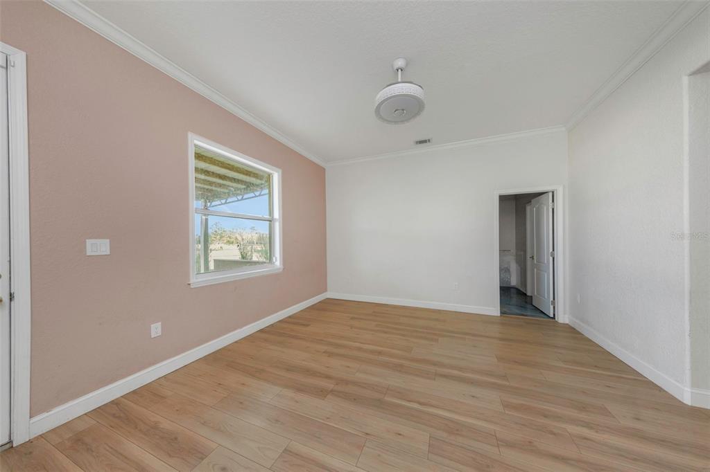 20138 Bowman Road Spring Hill, FL 34610 - Photo 22 of 40 a view of an empty room with window and closet area