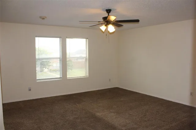 a bedroom with a bed and a table