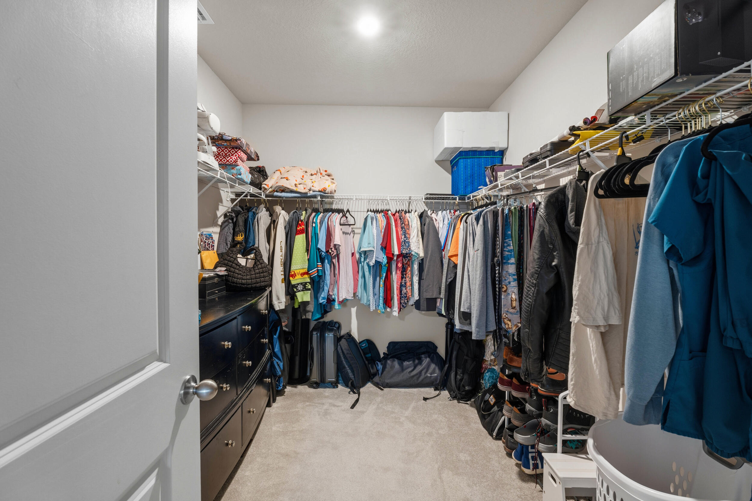 271 Raspberry Road Fort Pierce, FL 34981 - Photo 13 of 42 a view of walk in closet with clothes