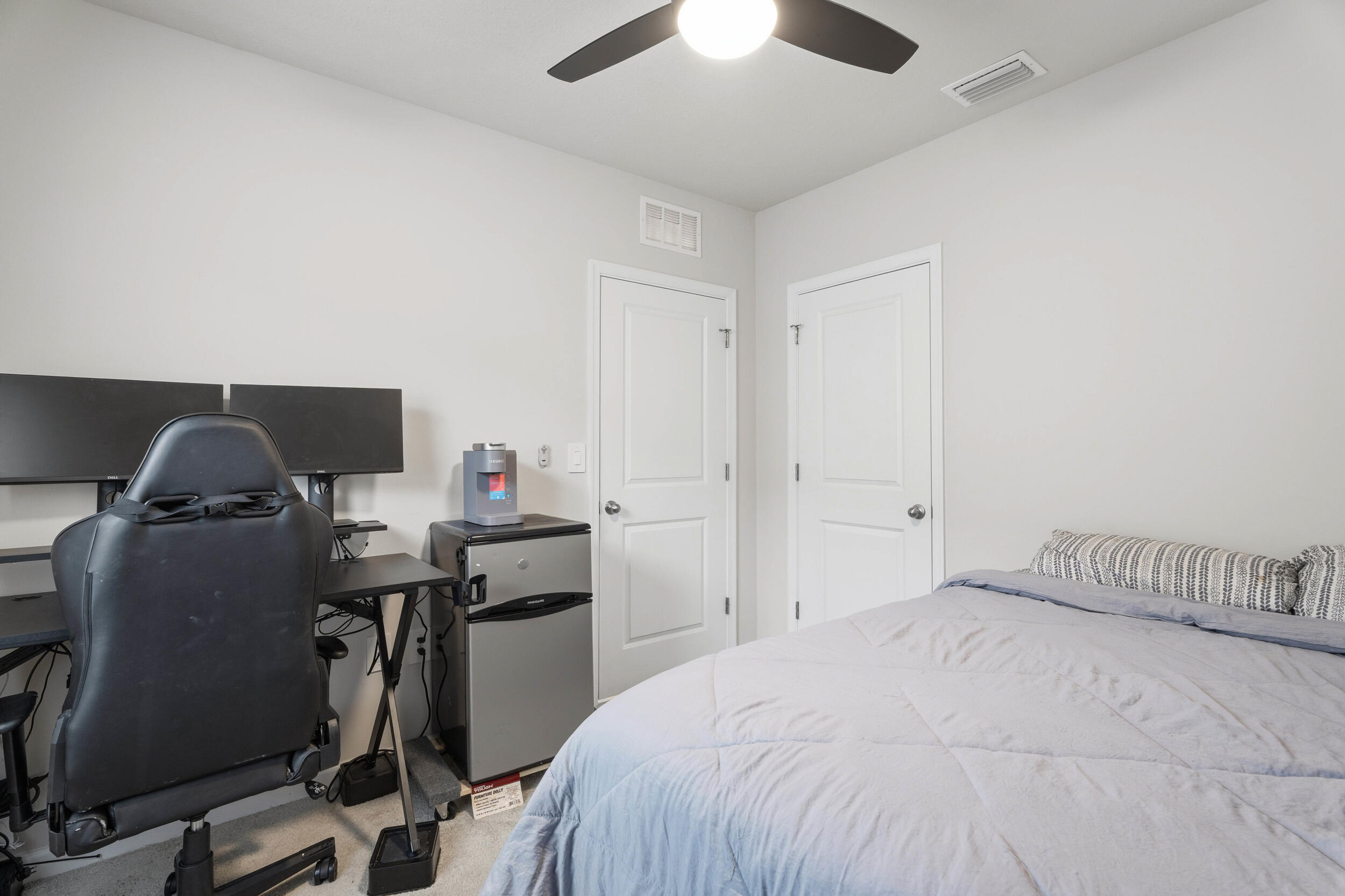 271 Raspberry Road Fort Pierce, FL 34981 - Photo 16 of 42 a bedroom with a bed and a desk