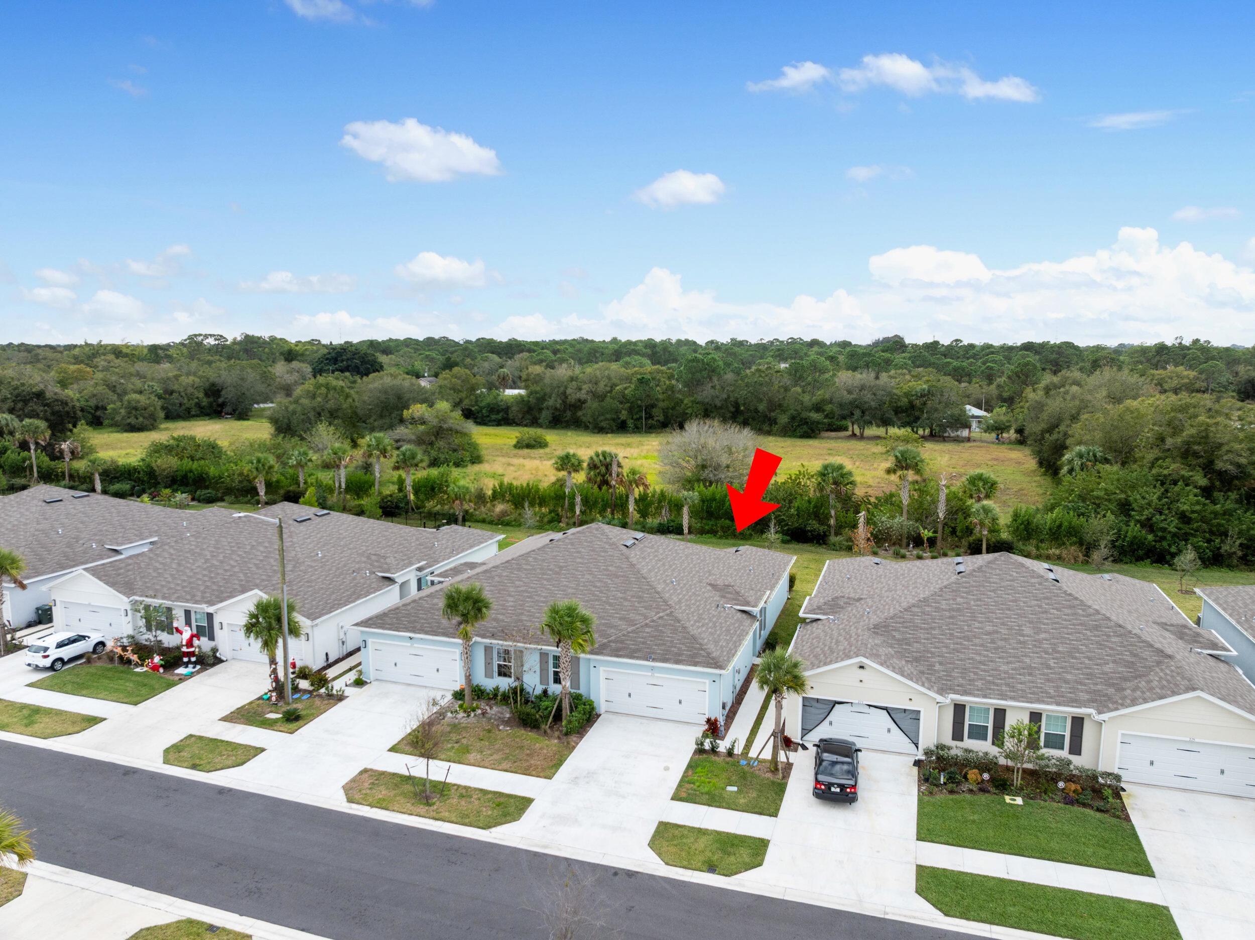 271 Raspberry Road Fort Pierce, FL 34981 - Photo 37 of 42 a view of house with outdoor space and mountains