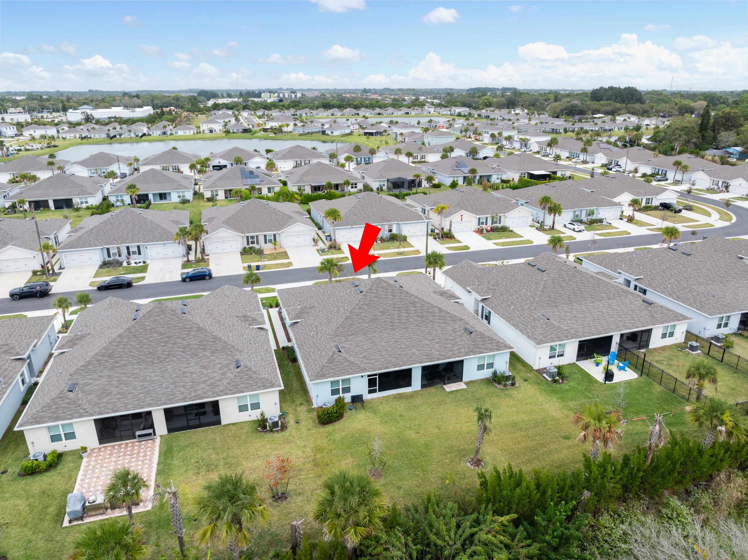 271 Raspberry Road Fort Pierce, FL 34981 - Photo 38 of 42 an aerial view of residential houses with outdoor space and ocean view