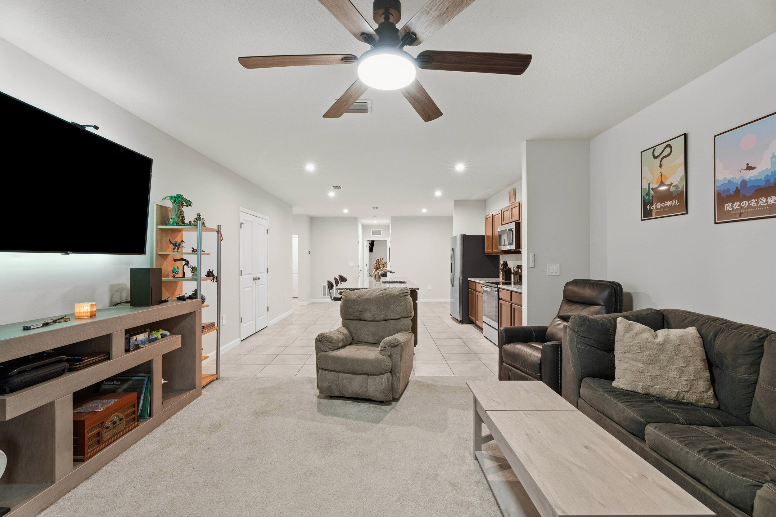 271 Raspberry Road Fort Pierce, FL 34981 - Photo 10 of 42 a living room with furniture and a flat screen tv