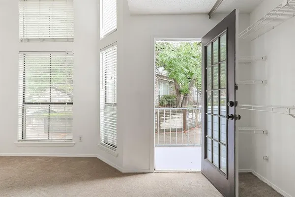 a view of a room that has a large window