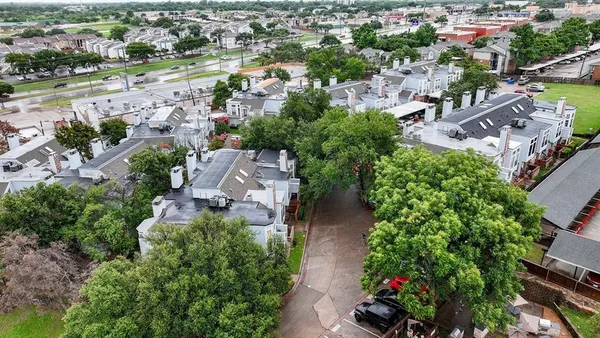 an aerial view of a city with lots of residential buildings